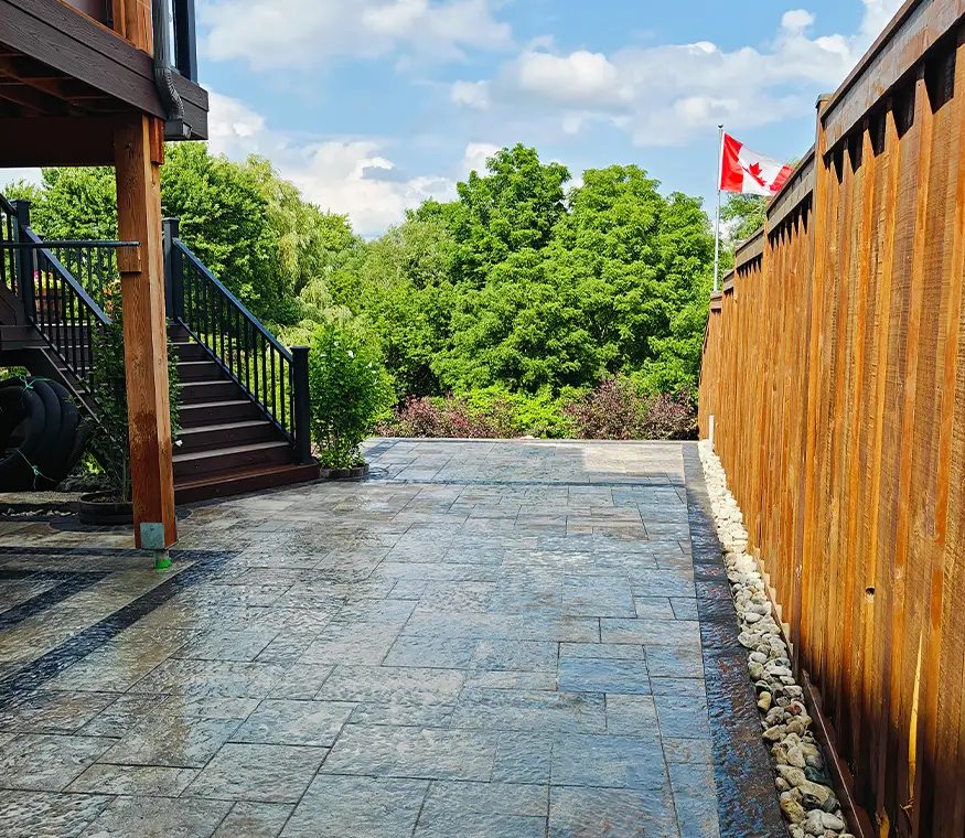 Backyard interlock patio and drainage-ready walkway in Kitchener Ontario
