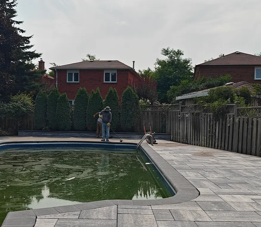 Backyard interlock patio installation in Brampton Ontario with clean modern paver layout