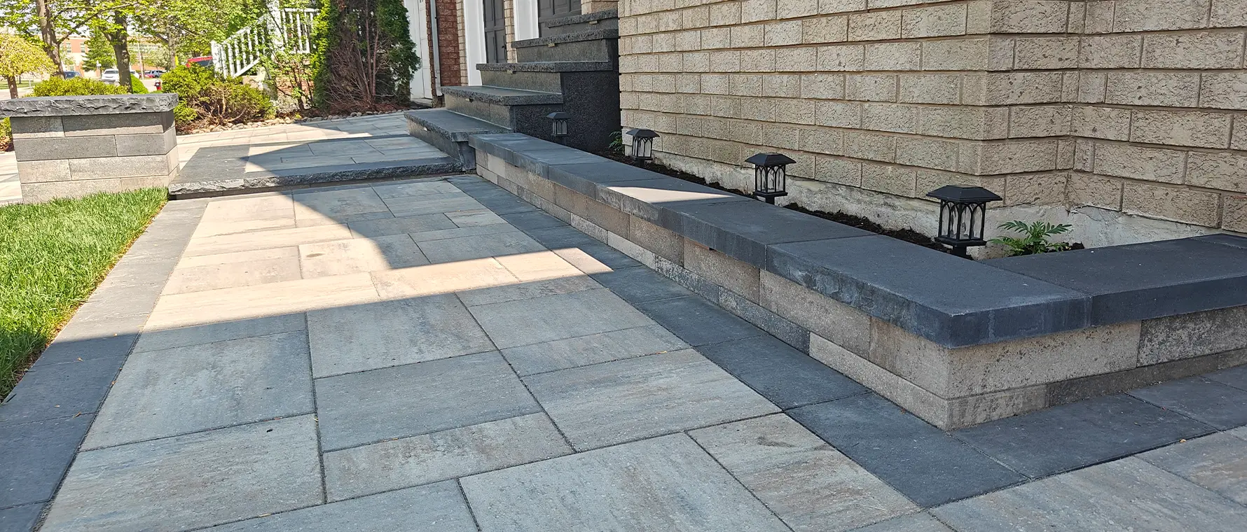 Backyard pool area with paver patio installed by hardscape patio contractors in Brampton Ontario