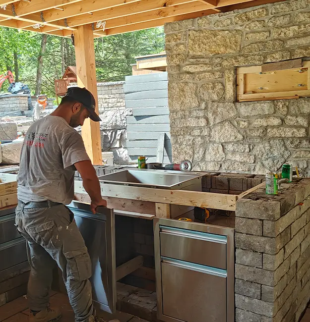 Base preparation and grading work for interlock installation in Aurora Ontario by residential landscape contractors