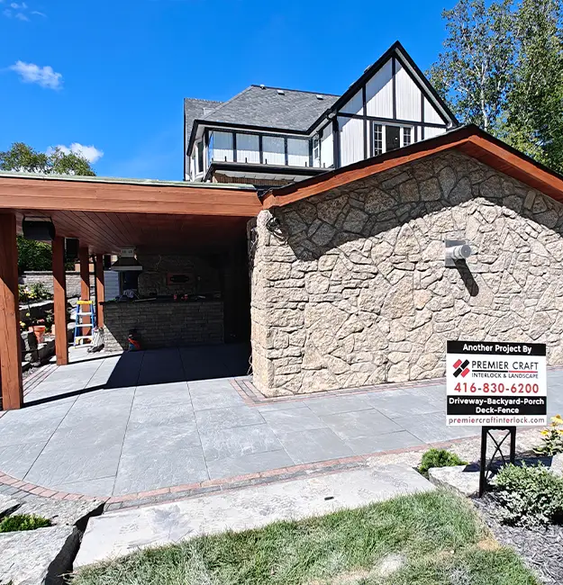 Custom stone pavilion and patio built by experienced landscape hardscape contractors in Aurora Ontario