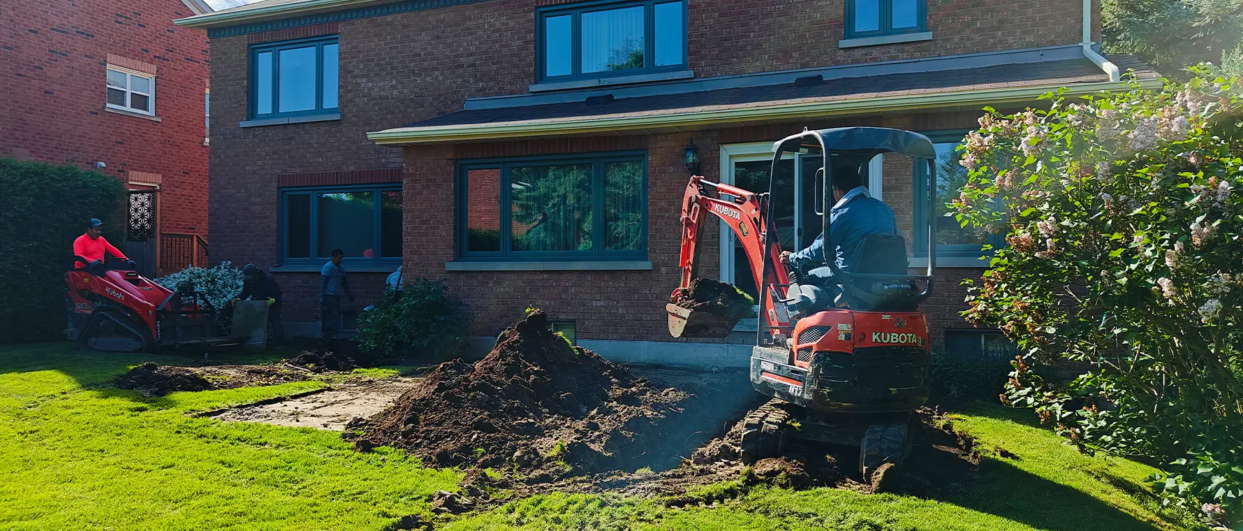 Excavation work using compact equipment for hardscaping project in Richmond Hill