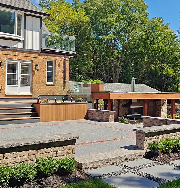 Finished backyard interlock and landscape project completed by landscaping companies in Aurora Ontario