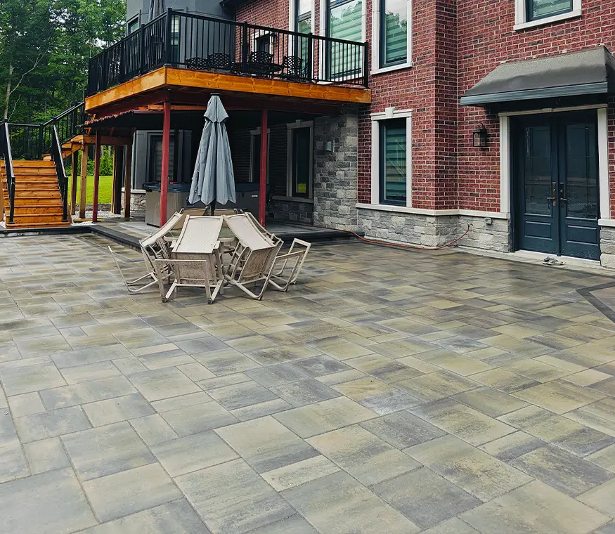 Front facade view with interlock driveway and stone retaining borders