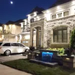Front yard stone water feature with stacked stone and landscaping at Woodbridge home