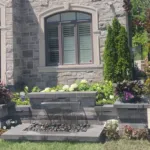 Front yard water feature with integrated LED lighting at night