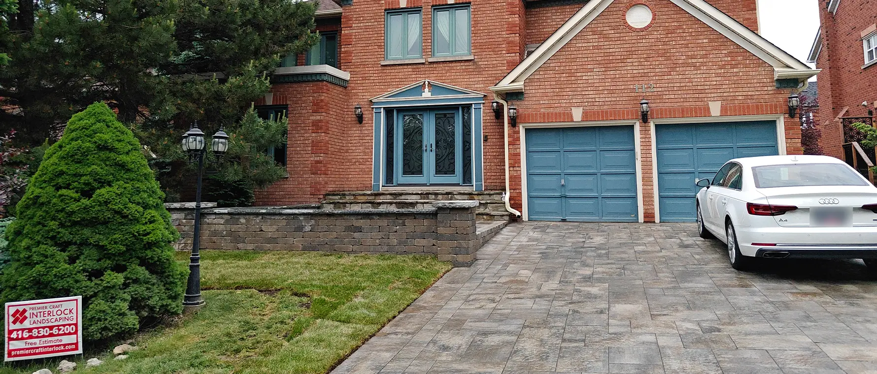 Interlock driveway and front entrance with retaining wall in Richmond Hill