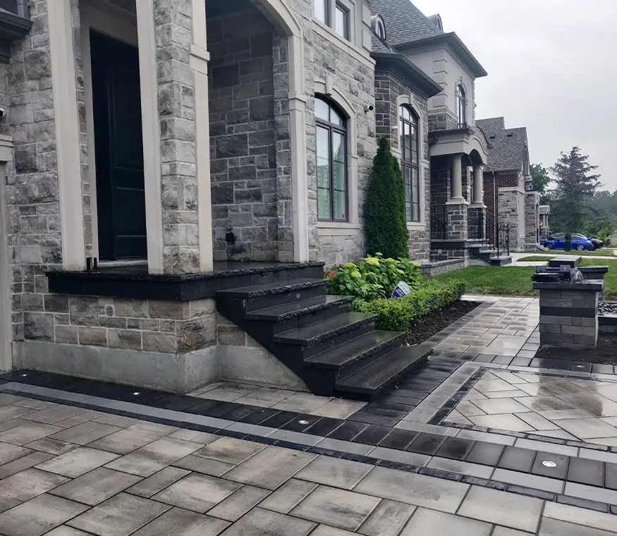 Interlock driveway installation with large-format pavers at Woodbridge residence