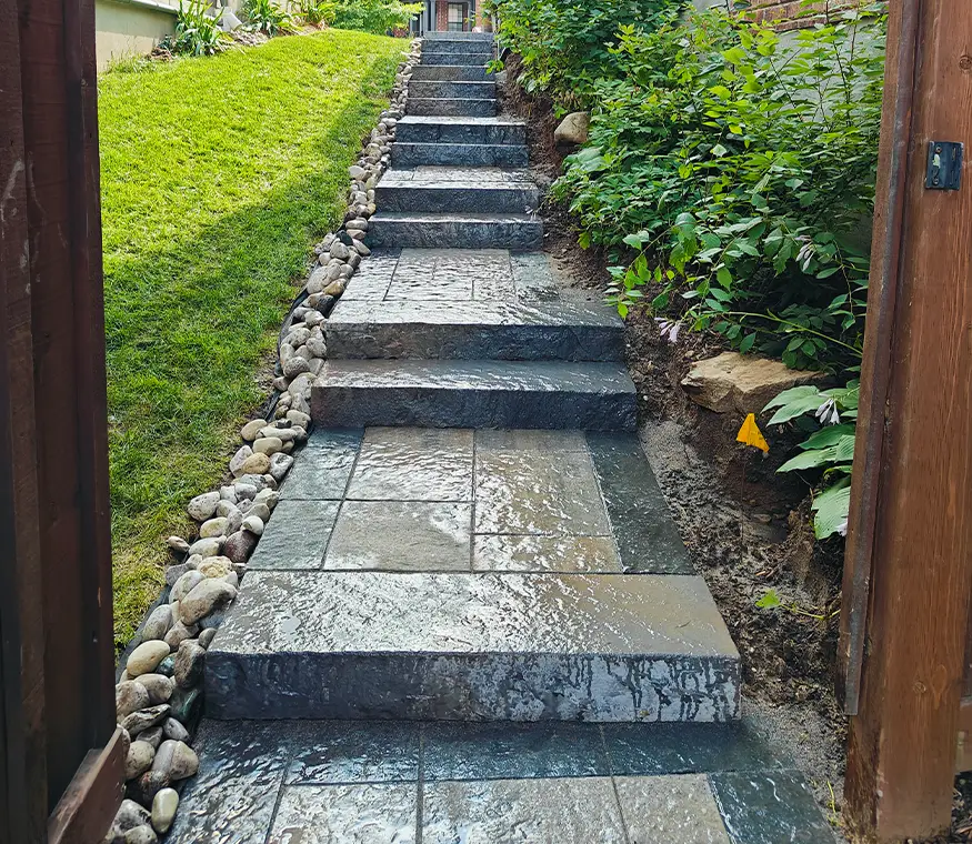 Lower-level interlock patio and retaining wall construction in Kitchener Ontario
