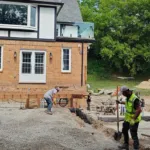 Luxury backyard interlock patio and retaining walls installed by landscape hardscape contractors in Aurora Ontario