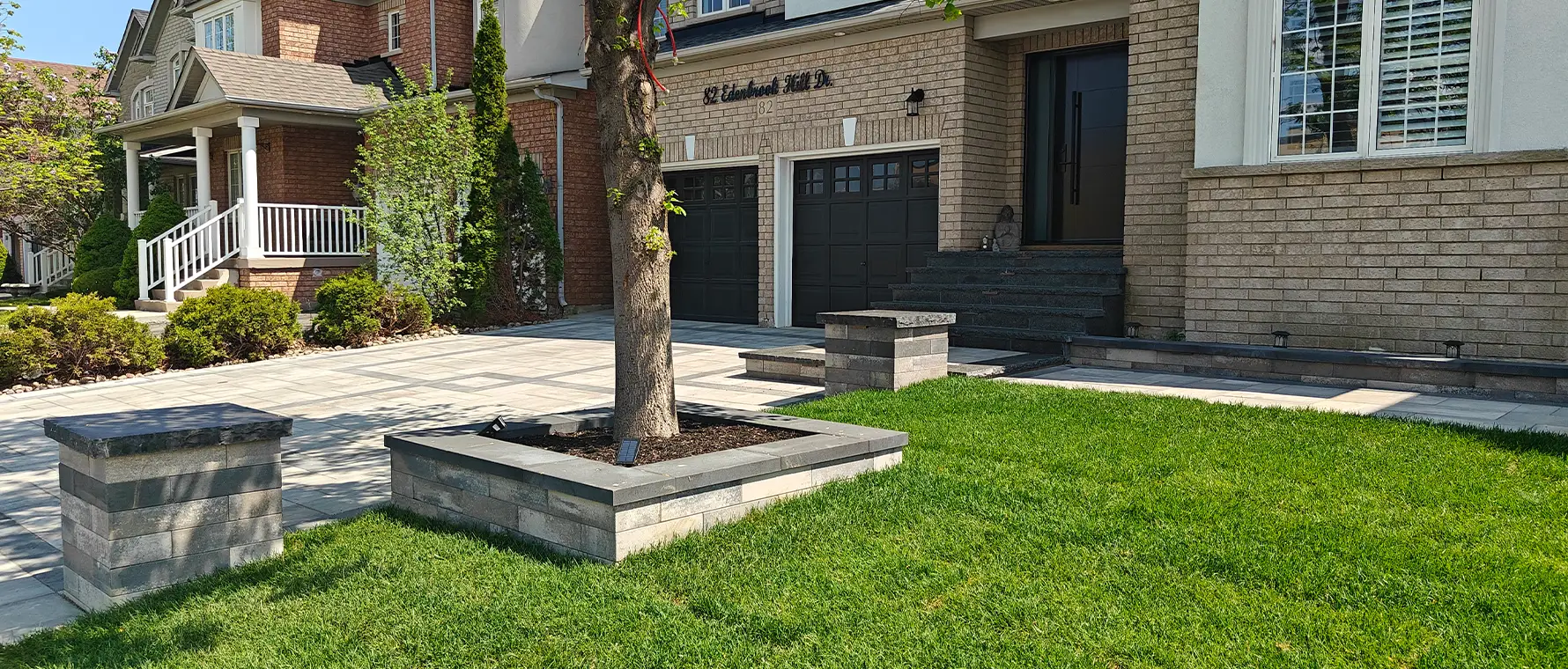 Modern front yard hardscape design and paver installation in Brampton Ontario by landscape contractors