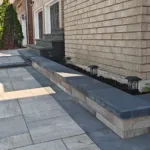 Side yard interlock walkway and retaining wall built by hardscape landscapers in Brampton Ontario