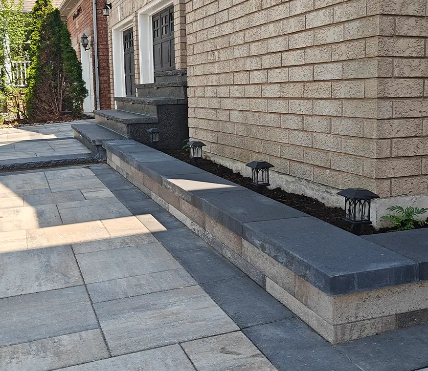 Side yard interlock walkway and retaining wall built by hardscape landscapers in Brampton Ontario