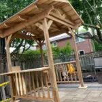 Deck and pergola combination built by landscape contractor