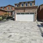 Interlocking brick driveway construction for residential home