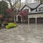 Interlocking driveway installation with modern pattern