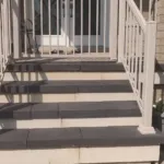 Manufactured stone porch cladding enhancing exterior style