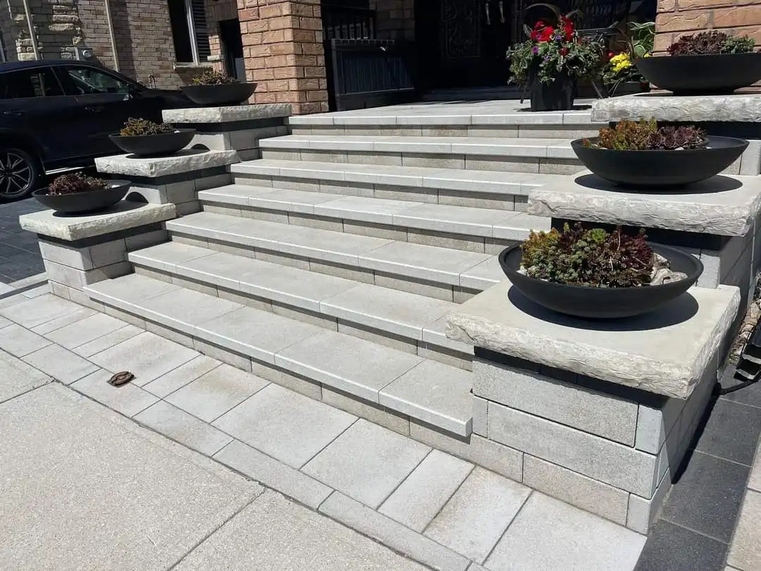 Manufactured stone porch installation by professional hardscape contractor