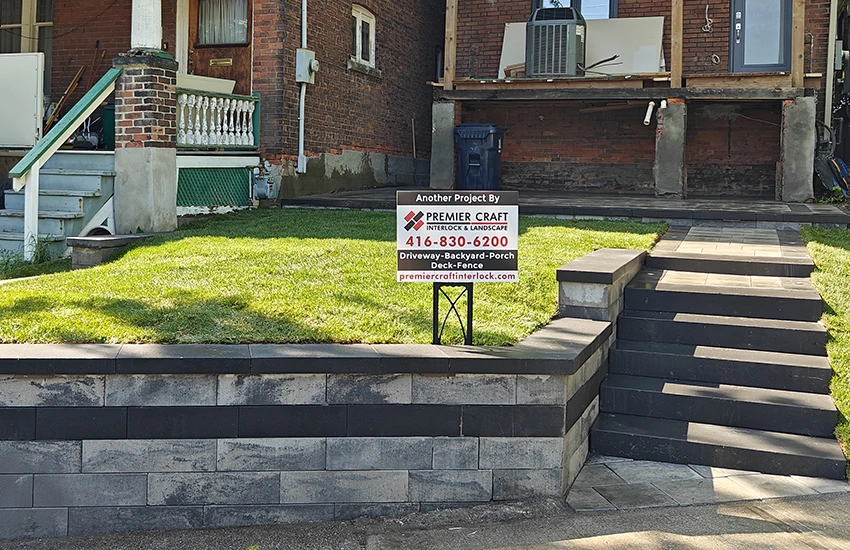 Retaining wall and stone steps installation by professional hardscape contractor at a residential property