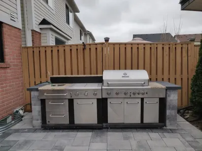 Stone BBQ and outdoor kitchen feature by interlocking stone contractor