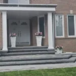 Stone porch construction complementing home exterior