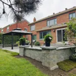 Wall design installation complementing patio area