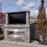 Backyard Outdoor TV unit and Fireplace Combo with Granite coping in Brampton and Mississauga